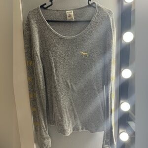 PINK gray shirt with logo on arms and front..